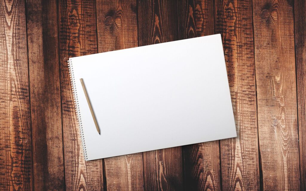 Pencil and notebook ready for sketching a garden plan