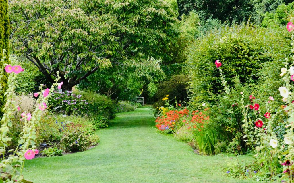Layered flower borders along a garden path