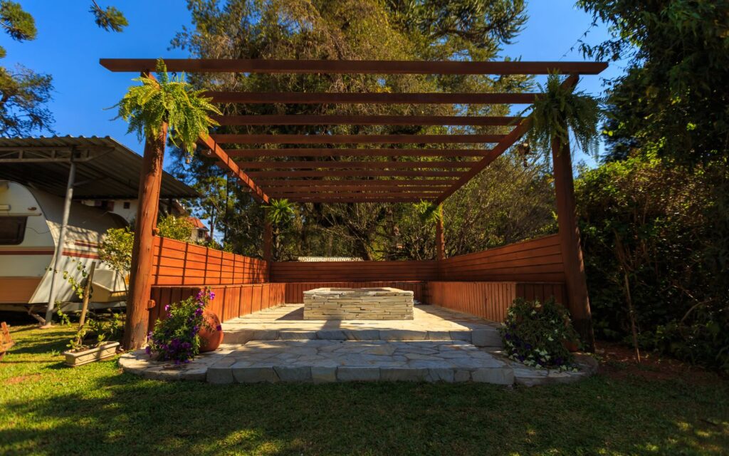 Wooden gazebo in a lush garden