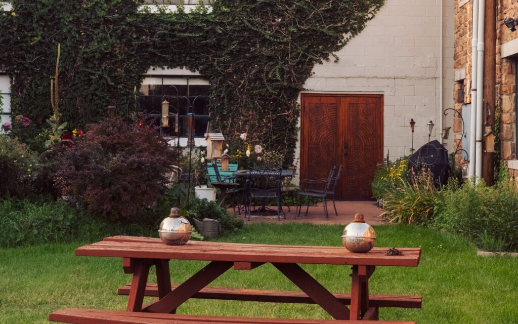 Wooden picnic table on a green lawn
