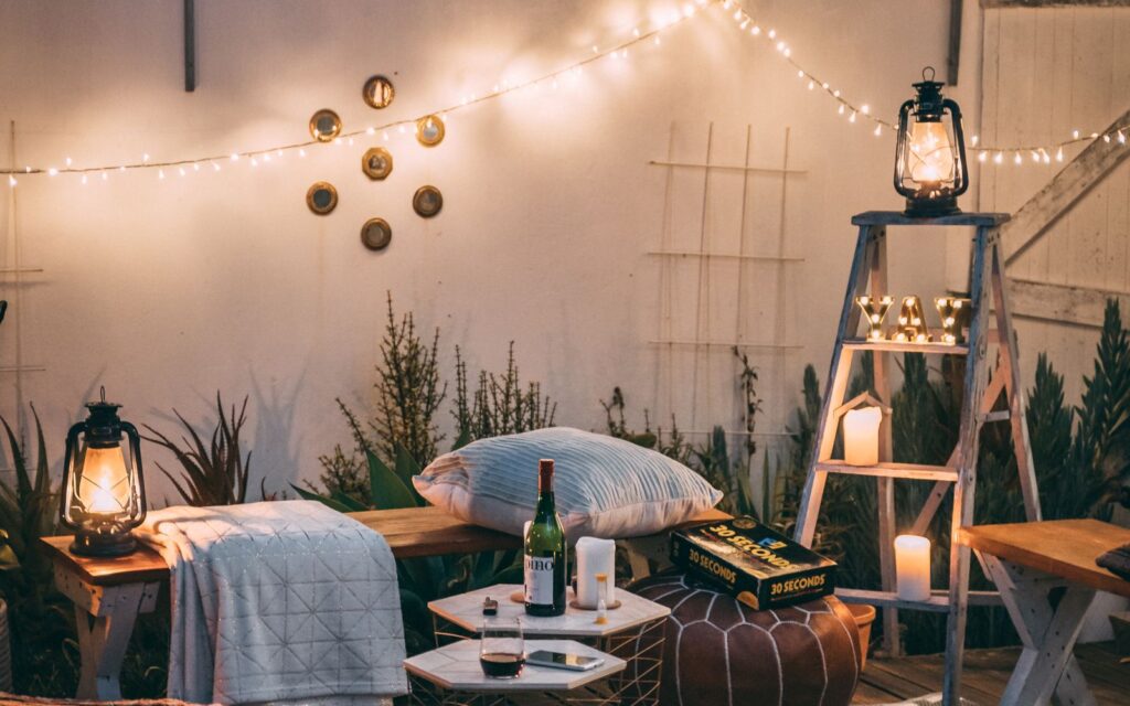 Cushions on wooden garden chairs with soft lighting