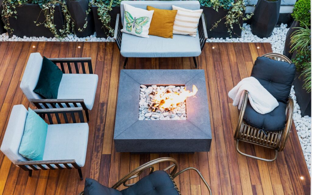 Patio seating arranged around a central fire pit