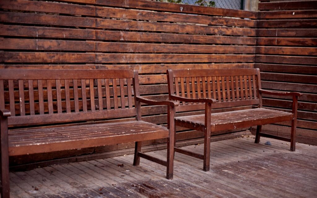 Rustic wooden benches on an outdoor patio