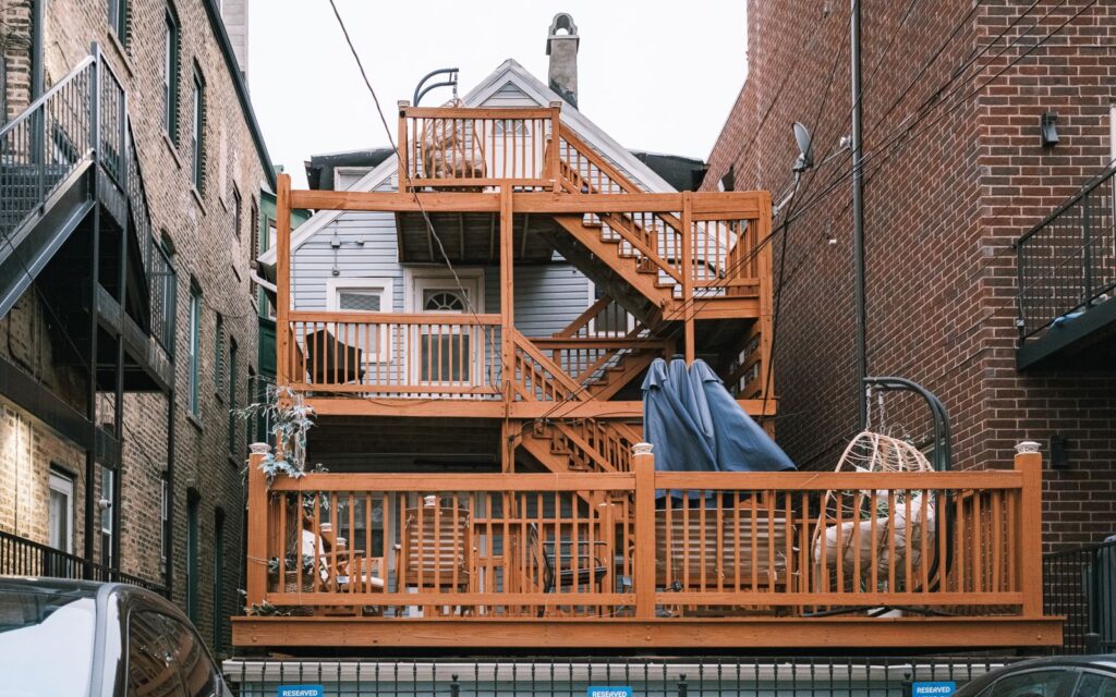 Multi-level wooden deck in a small garden