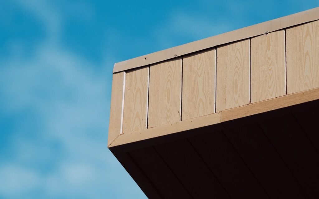 Timber roof against a blue sky
