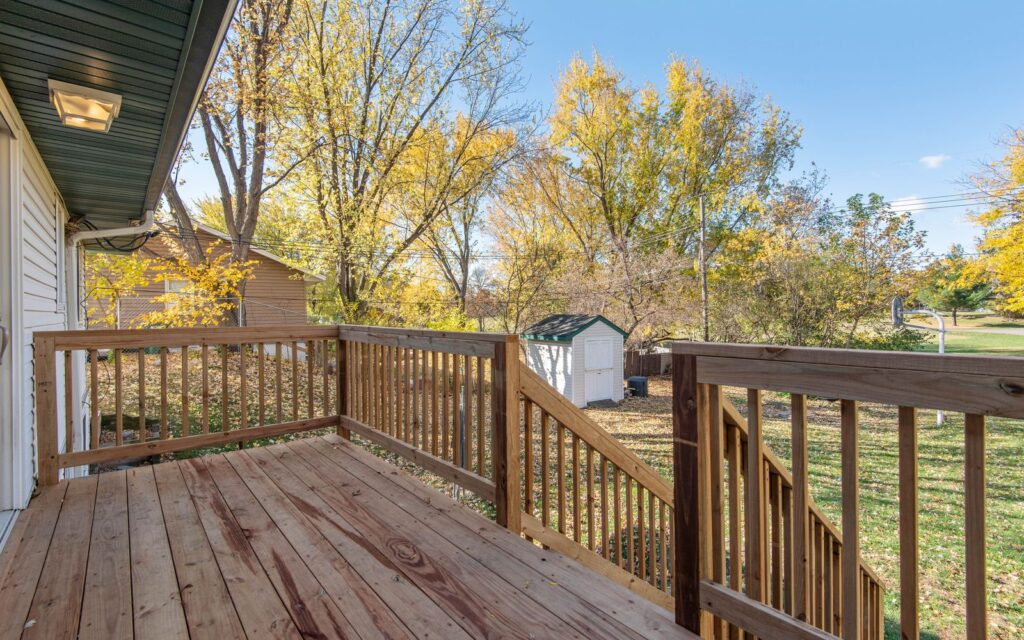 Spacious timber deck overlooking an autumn garden
