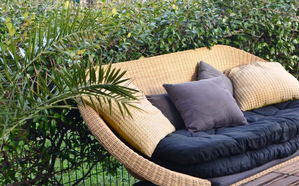 Wicker outdoor sofa on a patio