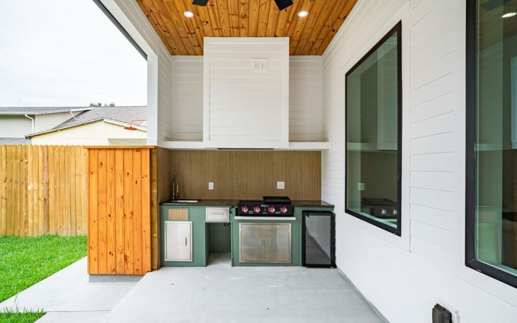 Outdoor kitchen with barbecue in a backyard