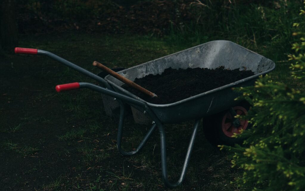 Wheelbarrow of soil ready to fill a raised bed