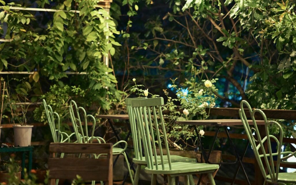 Patio with chairs and string lights at night