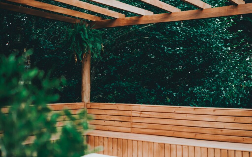 Patio with built-in wooden benches and planting